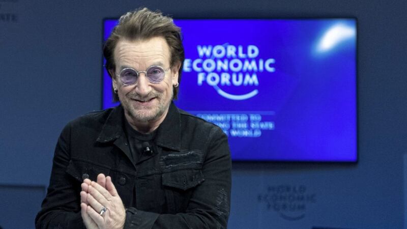 Irish singer Bono gestures as he arrives for a panel session during the the 49th Annual Meeting of the World Economic Forum, WEF, in Davos, Switzerland. Picture by Laurent Gillieron, Keystone via Associated Press 