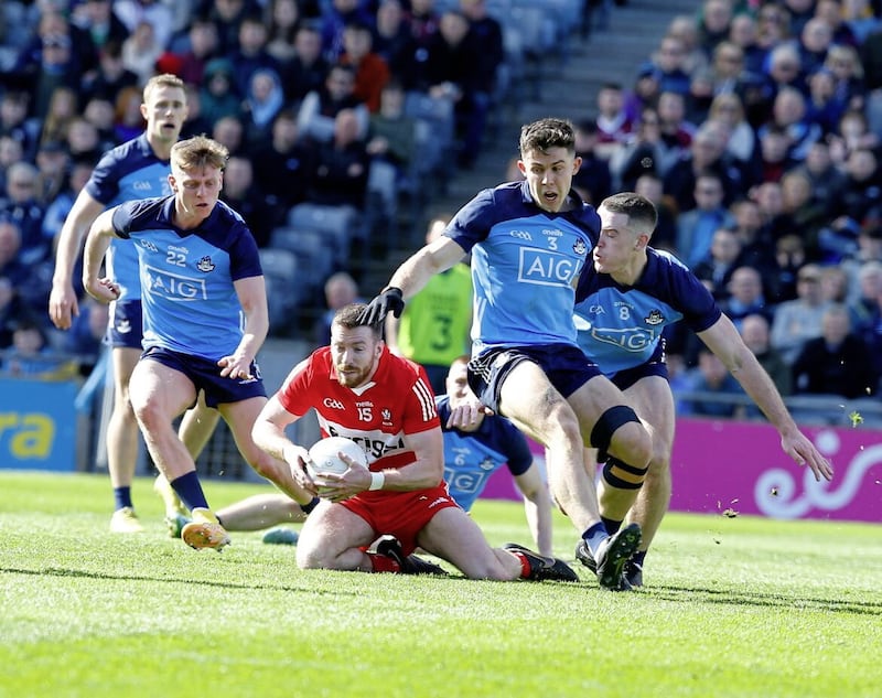 Dublin players converge on Derry&#39;s Niall Loughlin during the Allianz Division Two Final at Croke Park Dublin. Pic Philip Walsh 