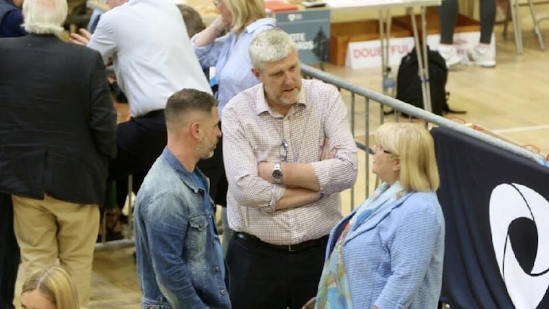 Sinn Féin MLA John O'Dowd (centre) pictured with wife and newly elected Lurgan councillor Mary O'Dowd at Friday's count. Picture by Mal McCann