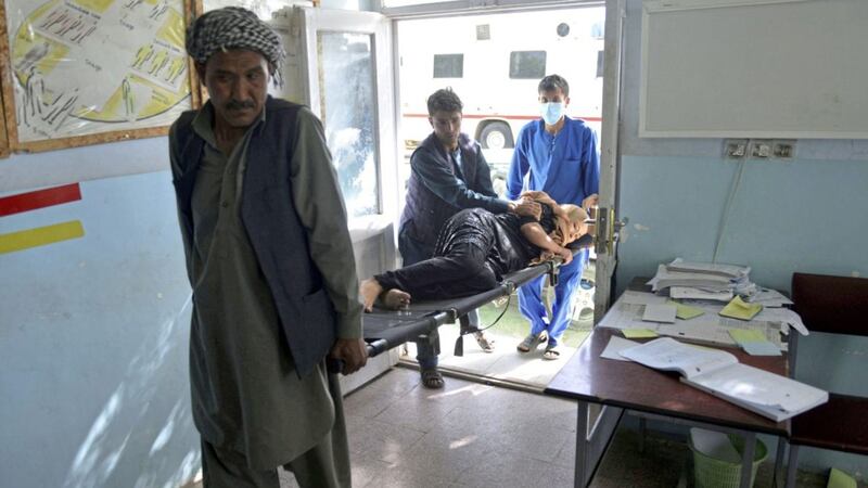 An injured woman is brought into a hospital in Ghazni province in Afghanistan after the Taliban launched a massive assault at the weekend. Picture by Mohammad Anwar Danishyar/AP  