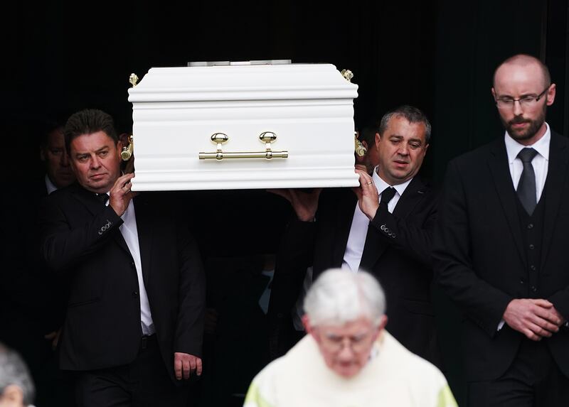 Michael Dennany (left) carries the coffin bearing the remains of his children Mikey (2) and Thelma Dennany (5) from St Mel’s Cathedral, Longford, following their funeral mass. The brother and sister died in a car fire in Co Westmeath last week. 