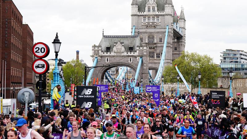 Runners cross Tower Bridge during the TCS London Marathon