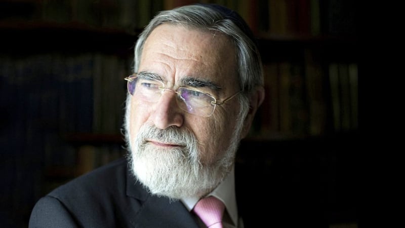 Former chief rabbi Jonathan Sacks, who died in November, led the first Holocaust Memorial Day in Belfast at the Waterfront Hall 