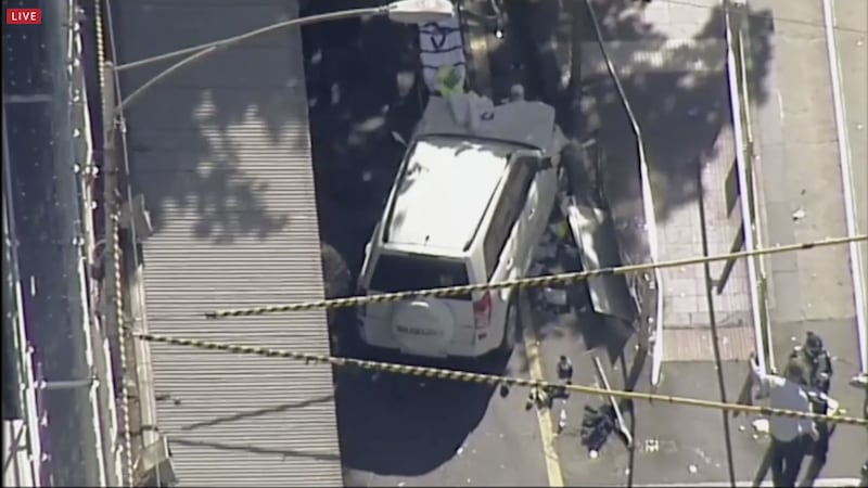 A white SUV vehicle is stopped after allegedly striking pedestrians, Thursday, December 21, 20217, in Melbourne, Australia&nbsp;