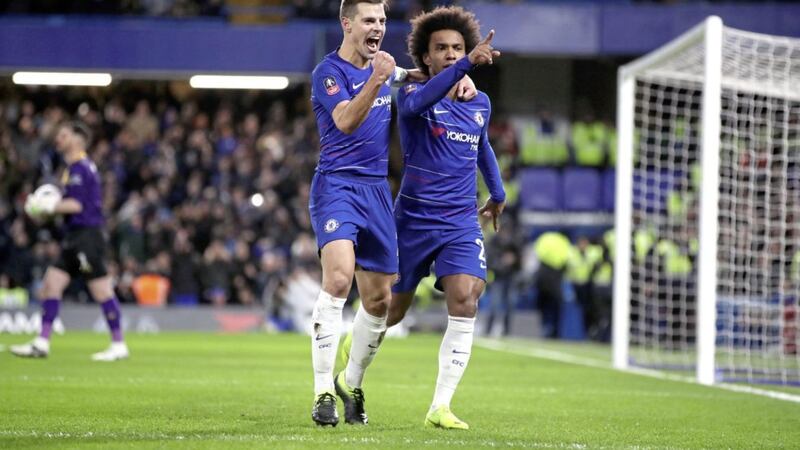 Chelsea&#39;s Willian (right) celebrates with Cesar Azpilicueta after scoring his side&#39;s first goal of the game from the penalty spot during the FA Cup fourth round match against Sheffield Wednesday at Stamford Bridge, London 