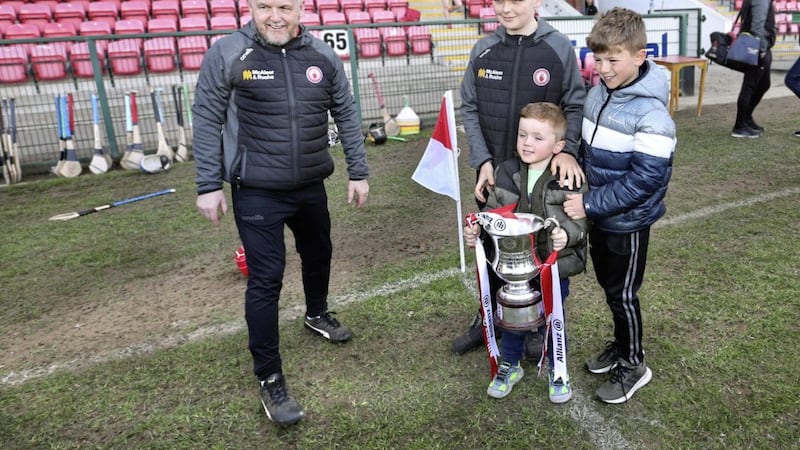 Tyrone manager Michael McShane and his sons get some pictures taken with the cup after beating Armagh during the National Hurling League Division 3A Final match at Owenbeg on Saturday Picture: Margaret McLaughlin. 