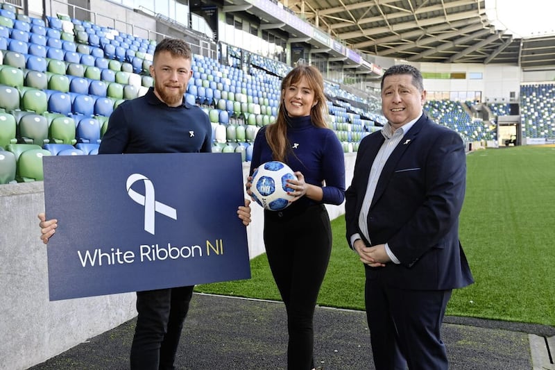 Vincent McCorry and Tahnee McCorry, both of White Ribbon NI), with NI Football League chief executive Gerard Lawlor. 