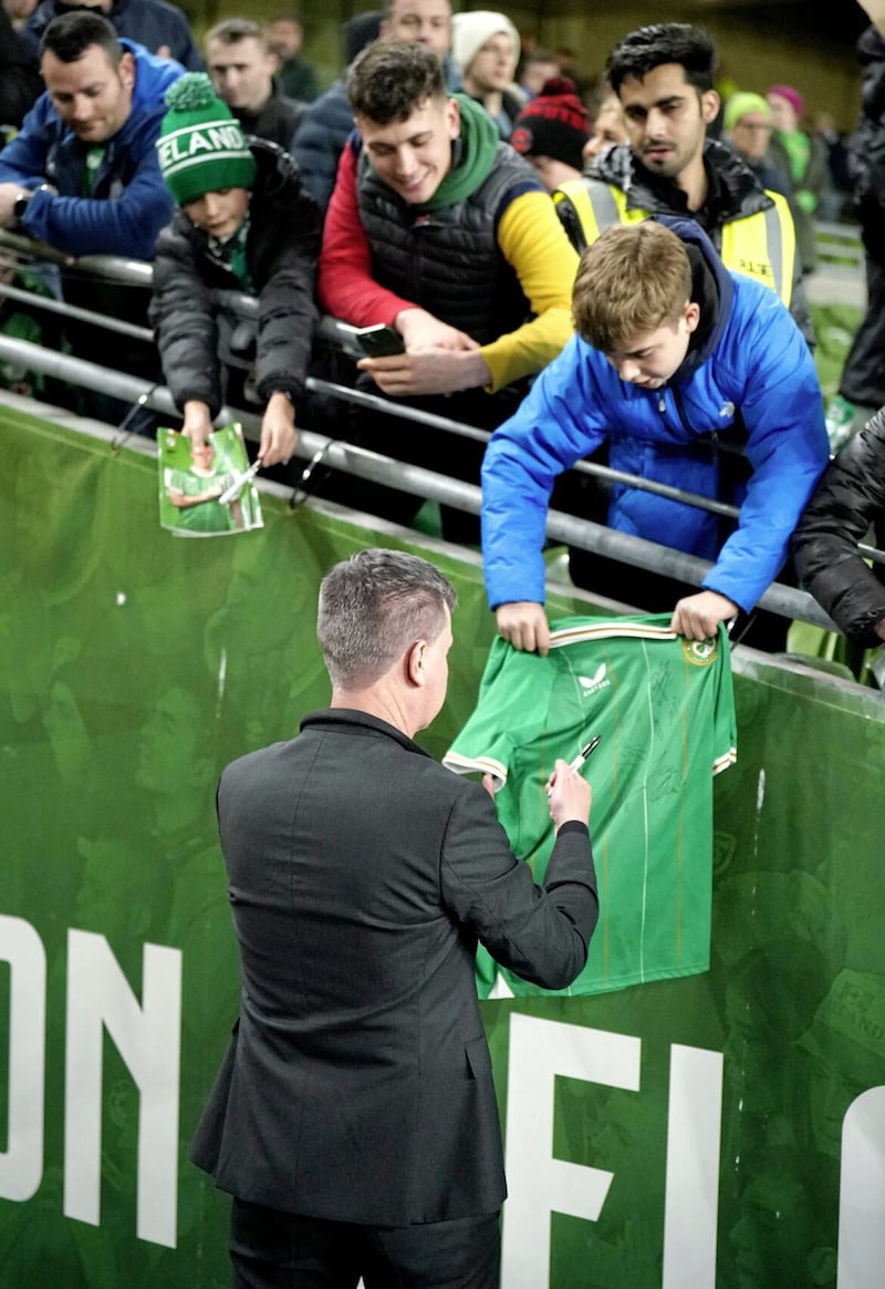Republic of Ireland head coach Stephen Kenny signs a shirt for a fan after Tuesday night&#39;s 1-1 draw with New Zealand 