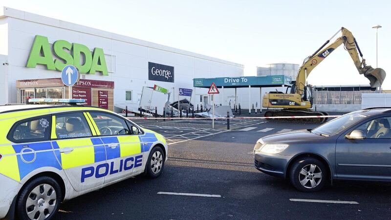 A digger was used to steal two cash machines at the Asda store in Antrim 