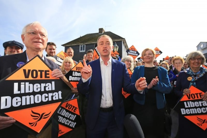 Liberal Democrat leader Tim Farron talks to supporters on the general election campaign during a visit to Lewes in East Sussex.