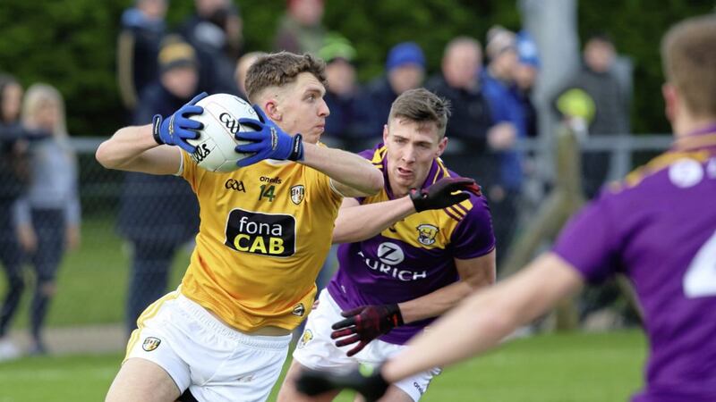 Antrim&#39;s Ruairi McCann, who scored 2-1 for the Saffrons, gets away from Wexford&#39;s Gavin Sheehan. Picture by Cliff Donaldson 