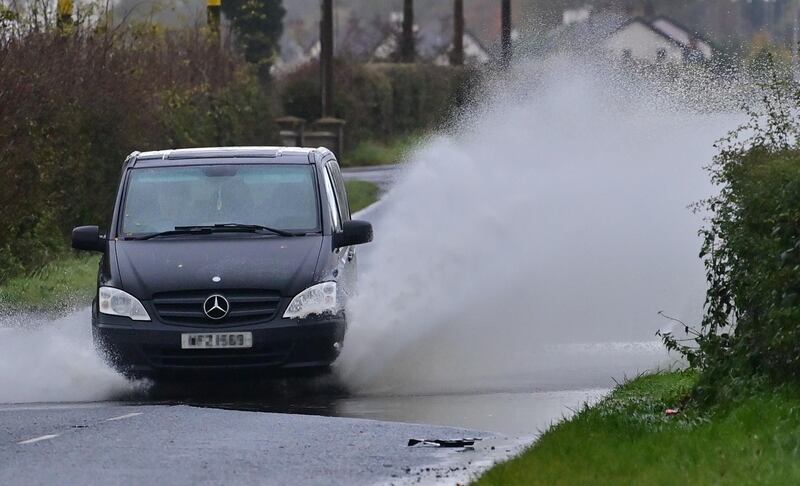  Motorists struggle through the floods on the Glenavy Road near Crumlin. Picture by Colm Lenaghan/Pacemaker