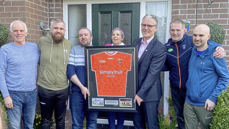 Jarlath Burns visited the McNally family and presented them with a framed Armagh GAA jersey. Picture from Brendan McNally/Twitter  