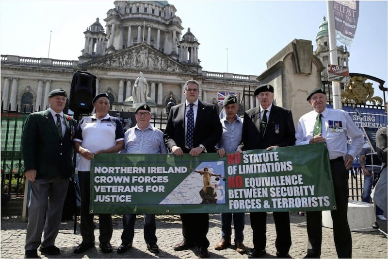 DUP MP Gavin Robinson joins protesters at a rally at Belfast City Hall against the prosecution of British Army veterans. Picture by Hugh Russell