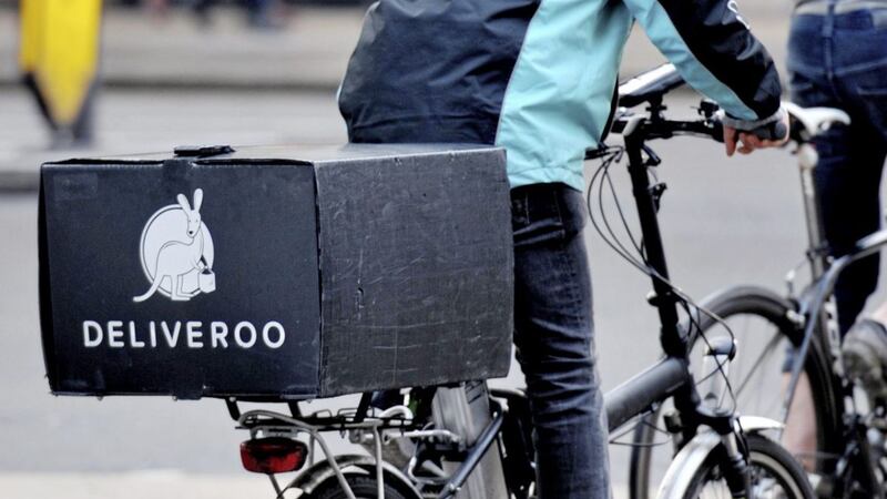 Deliveroo boosted sales in the first three months of the year, despite facing tough comparisons from a year earlier when restaurants were shut due to the pandemic 
