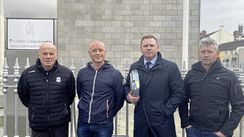 Sean McGlinchey, Dominic McGlinchey, solicitor Ciar&aacute;n Mulholland and Anthony McNeil pictured in Dundalk this week. 