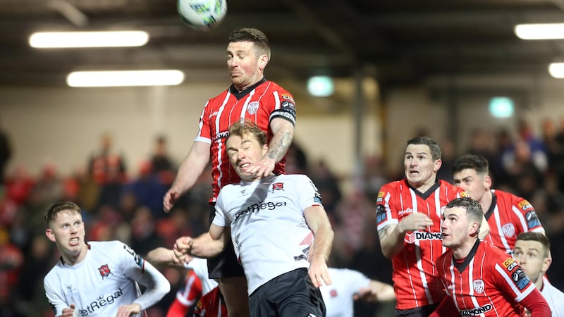 Derry City’s Patrick McEleney rises above Dundalk’s Greg Sloggett during Friday night’s goalless draw at the Brandywell.  Picture by Margaret McLaughlin
