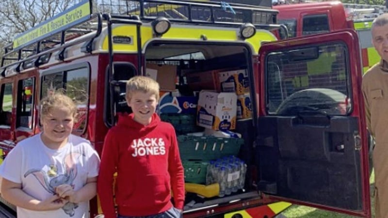 Co Down school boy Charlie Thomson and his sister, Erin have so far helped raise more than &pound;3,700 to help buy supplies of bottled water and food for the firefighters who are tackling fires on the Mourne Mountains 