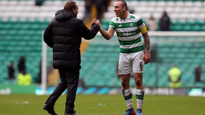 Celtic captain Scott Brown (right) says manager Brendan Rodgers (left) is always driving them on to be better.