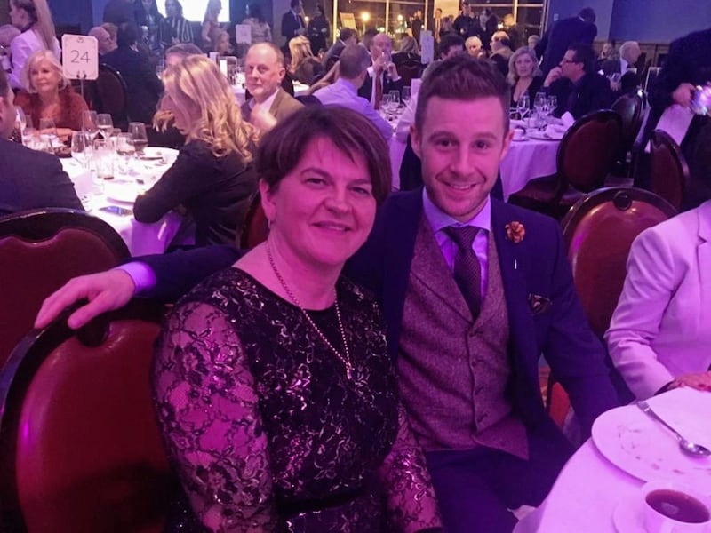 DUP leader Arlene Foster with motorcycle racer Jonathan Rea at a gala dinner in Belfast marking the official build-up to The 148th Open golf tournament at Royal Portrush 