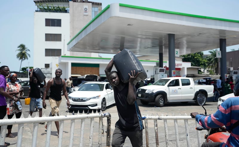 Long queues have formed at petrol stations in Nigeria (Sunday Alamba/AP)