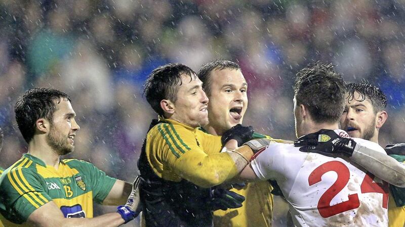 Donegal's Neil McGee puts out his tongue at a Tyrone player during last year's League meeting in Ballybofey.<br /> Picture Margaret McLaughlin