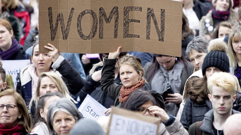 People take part in a protest in Dublin, in support of the woman at the centre of a rape trial after two Ireland ruby players were acquitted of rape. 