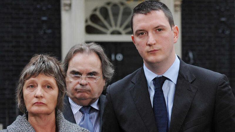 Geraldine Finucane and her son John (right) stand with solicitor Peter Madden outside 10 Downing Street in 2011 after David Cameron revealed he would hold only a QC-led review of her husband&#39;s case. Picture by Stefan Rousseau /PA Wire 