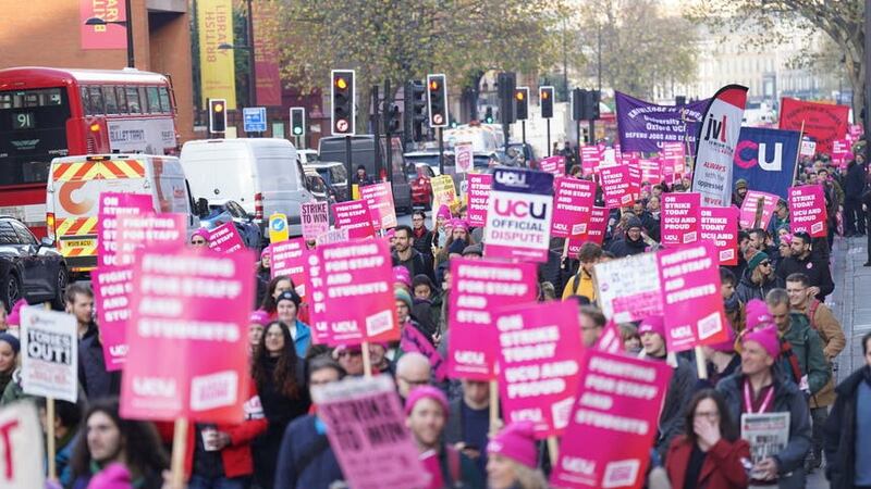 Protesters march along Euston Road near Kings Cross Station, London, during a rally as members of the University and College Union (UCU) take part 24-hour stoppage among university staff in an ongoing dispute over pay, pensions and conditions. Picture date: Wednesday November 30, 2022.