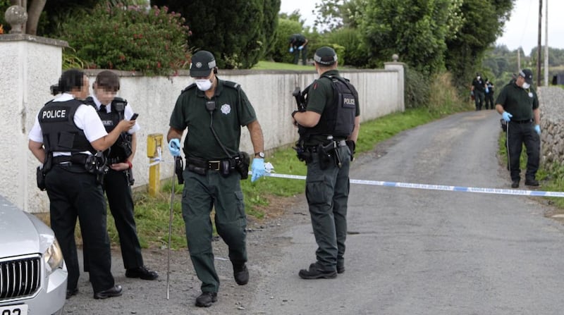 Police carry out a search after the fatal stabbing of Brian Phelan on the Carrivekeeney Road outside Newry. Picture by Matt Bohill 