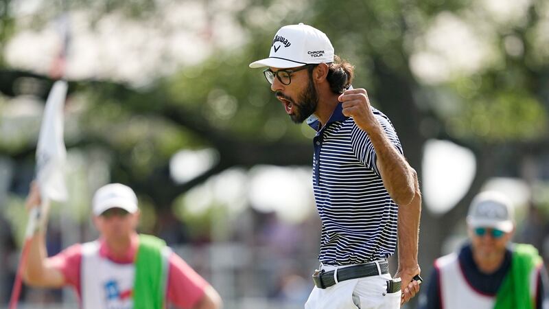 Akshay Bhatia reacts to his birdie putt on the 18th hole (Eric Gay/AP)
