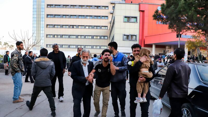 Families of victims of the explosions gather in the courtyard of a hospital in the city of Kerman (Sare Tajalli/ISNA via AP)