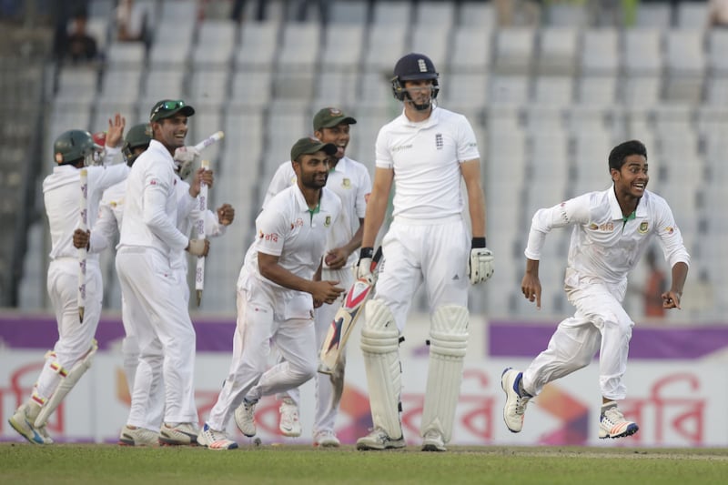 Bangladesh's Mehedi Hasan Miraz (right) and his team-mates celebrate their victory over England in the second cricket test match in Dhaka<br />&nbsp;