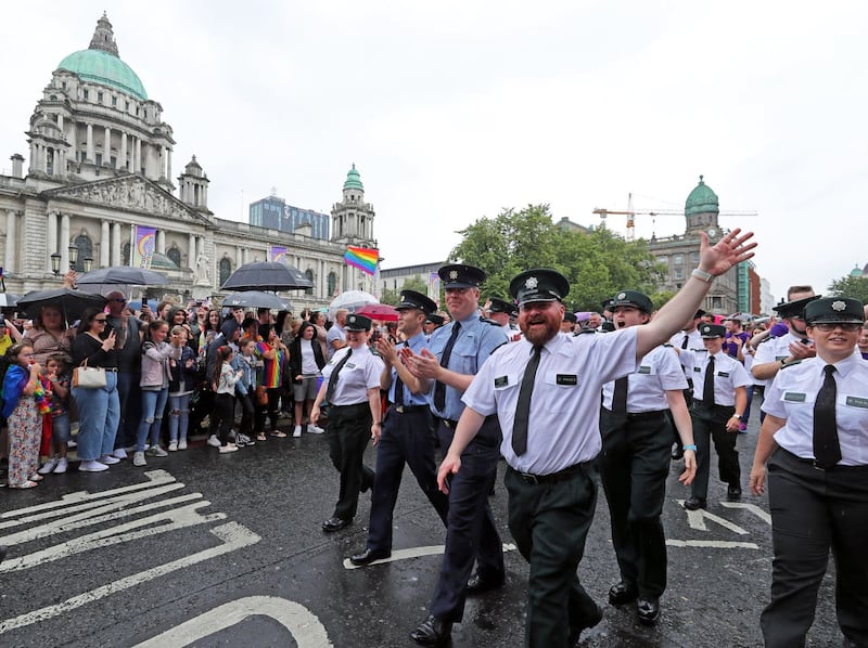 Members of the PSNI and Irish Garda march