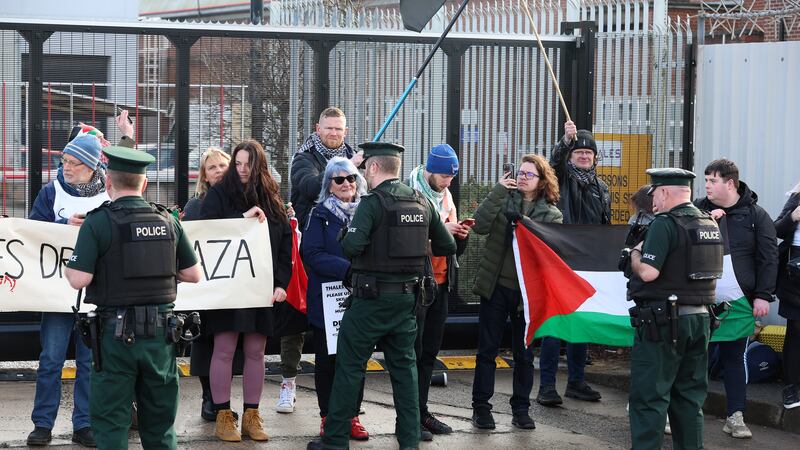 PSNI officers stand in front of Palestine supporters at they protest at the entrance to the Thales arms manufacturer in east Belfast. PICTURE: MAL MCCANN