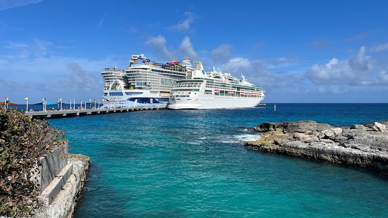Icon of the Seas at the CocoCay port next to Royal Caribbean ship, Vision of the Seas