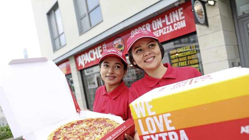 In-store team members Neeyati Vaghela and Luciana Matos celebrate Apache Pizza&#39;s expansion plans. Picture: Julien Behal Photography 