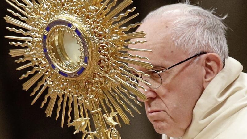 Pope Francis holds a monstrance as he celebrates a new year&#39;s eve vespers Mass in St Peter&#39;s Basilica 