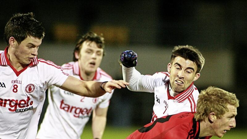 Danny Savage gives Tyrone&#39;s Tiernan McCaann and Richie Donnelly the slip. Pic: Seamus Loughran. 