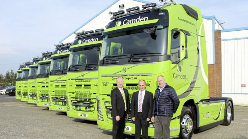 The new fleet of Volvo FH-500 lorries with: John Jenkins (in green tie) and Hugh Smith (in blue jacket) , both from Dennison Commercials; and Seamus Lavery from Camden Group (in pink tie) 