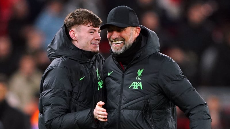 Liverpool manager Jurgen Klopp and Conor Bradley embrace after the Premier League match at Anfield against Chelsea. Picture by Peter Byrne/PA Wire