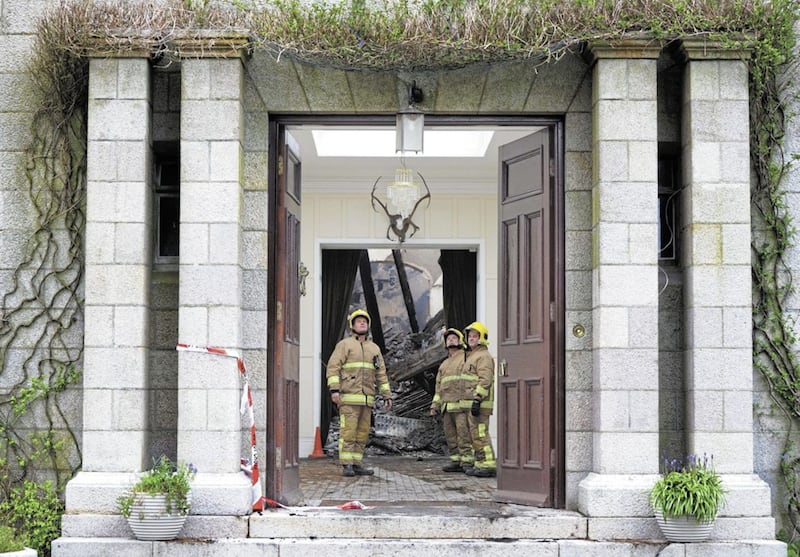 Firefighters survey the damage at Mourne Park House in 2013. Picture Charles McQuillan/Pacemaker. 