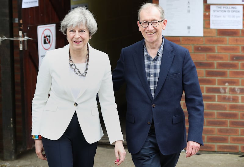 &nbsp;Theresa May and her husband Philip leave after casting their votes in the General Election at a polling station in the village of Sonning, Berkshire. <br />PRESS ASSOCIATION Photo.