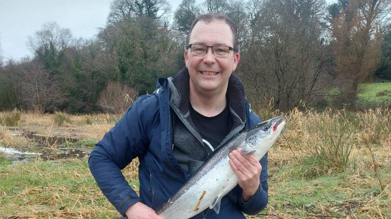 James Kenny holding the salmon he caught on New Year's Day