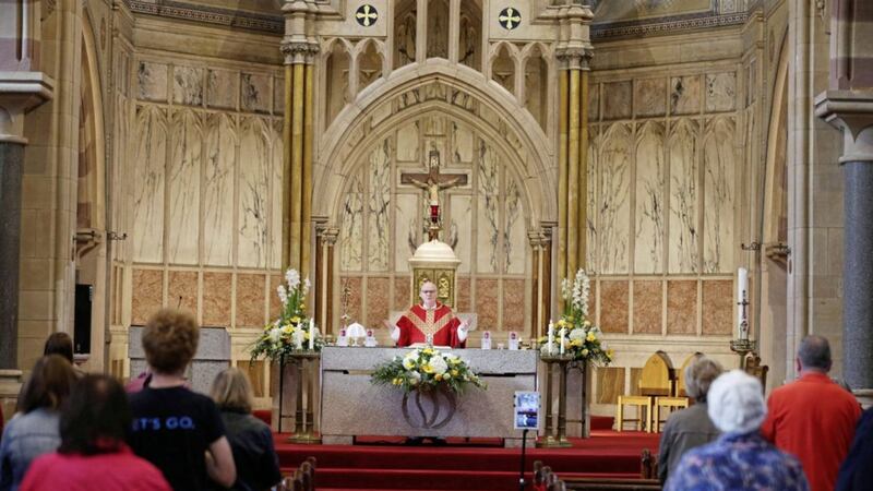 Fr Anthony Devlin celebrates Mass at St Paul&#39;s Church, Belfast. Parishes have been able to reopen for public worship following the relaxation in Covid-19 restrictions, but must follow strict rules around social distancing. Bishop of Derry Donal McKeown has encouraged parishes to &quot;proclaim seeds of hope&quot;. Picture by Mal McCann 