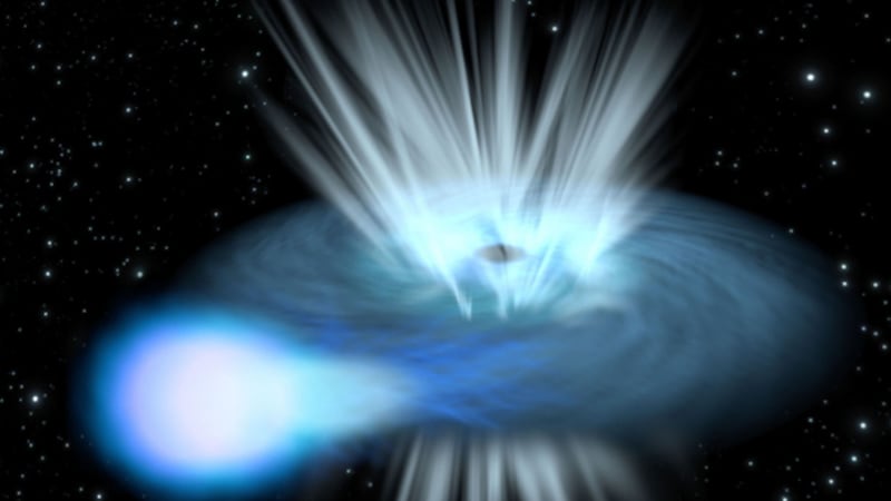 An artist’s impression of a black hole destroying a nearby star (ESA/C.Carreau)