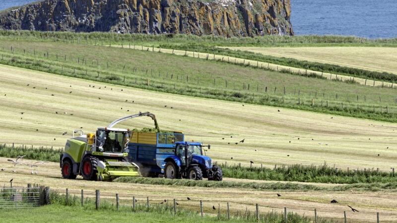 Farm workers collecting silage near Ballycastle, Co Antrim. The Republic is to import fodder from the UK for the first time in four years 