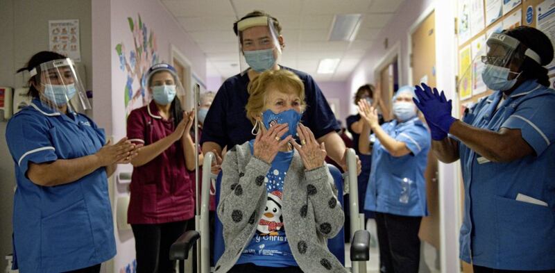 Margaret Keenan is applauded back onto her ward by nurses, after receiving the first Pfizer covid-19 vaccine at University Hospital Coventry. Picture by Jacob King/PA Wire 