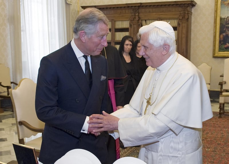 File photo dated 27/04/09 of the then Prince of Wales (now King Charles III) being welcomed by Pope Benedict XVI in the library at the Vatican. Pope Emeritus Benedict XVI has died, the Vatican has announced.
