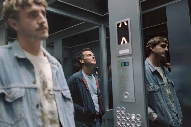A scene from All of Us Strangers showing Paul Mescal as Harry and Andrew Scott as Adam standing in a lift